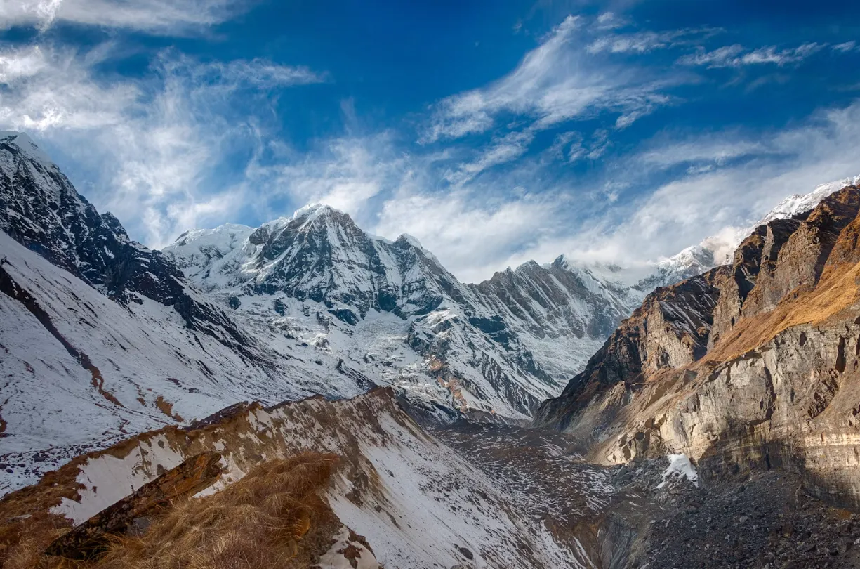 Panoramic view of Annapurna Sanctuary from Ghandruk, showcasing snow-capped Himalayan peaks, deep valleys, and the rugged landscape of Nepal’s Annapurna region.