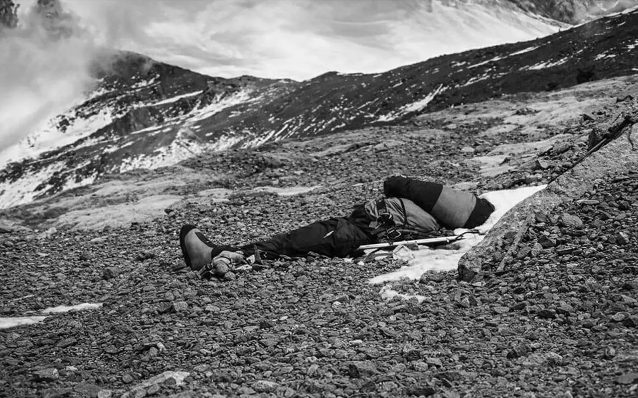 Archival photo of the Sleeping Beauty climber body resting on the rocky terrain of Mount Everest.